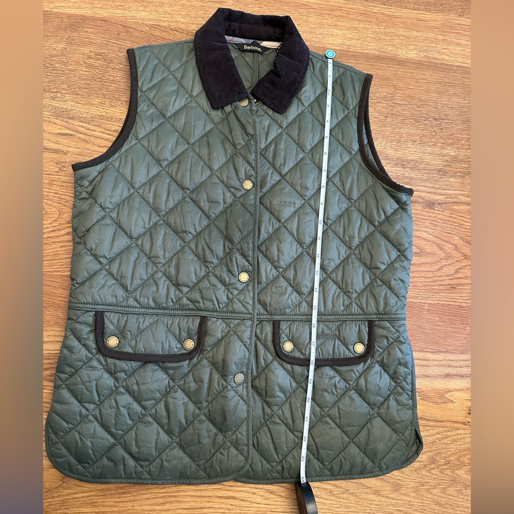 Barbour quilted vest in olive with brown corduroy collar and details on back.